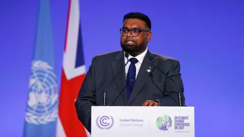 Reuters Guyana's President Mohamed Irfaan Ali speaks during the UN Climate Change Conference (COP26) in Glasgow, Scotland, Britain, November 2, 2021