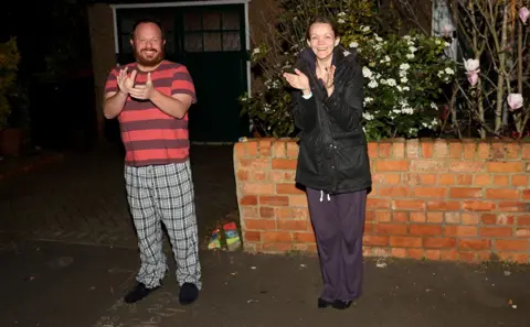 Getty Images Residents in Northampton cheer for the NHS