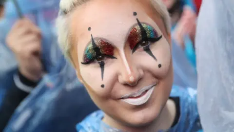 Getty Images Supporters of gay rights, including a young woman wearing glitter, celebrate following a vote at the nearby Bundestag in which parliamentarians approved a new law legalising gay marriage in Germany on 30 June 2017 in Berlin