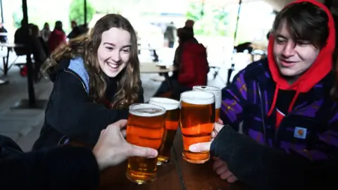 EPA Enjoying a pint in south London, 12 April 2021