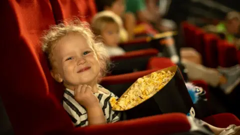 Getty Images Child with popcorn