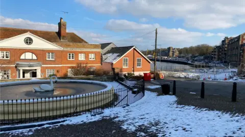 Swan fountain at Mistley and fencing