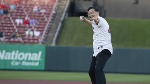 Twitter/Qin Gang Picture of former Chinese foreign minister Qin Gang throwing a pitch at a US baseball game