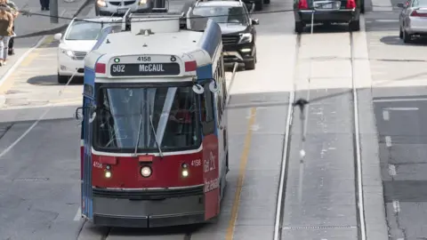 Getty Images Old streetcar moving along Bay Street.
