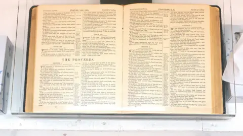 Reuters A Bible open to the book of Proverbs