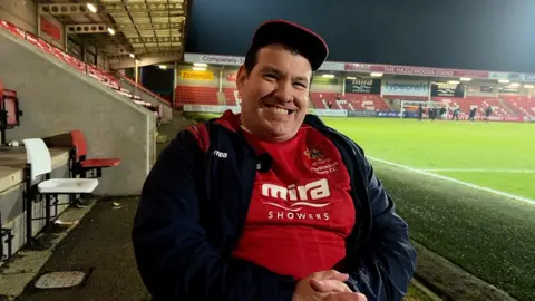 Cheltenham Town supporter smiling into camera