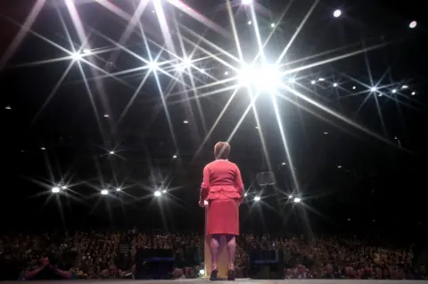 Jane Barlow/PA First Minister Nicola Sturgeon making her keynote speech on day three of the SNP autumn conference at the SEC, Glasgow