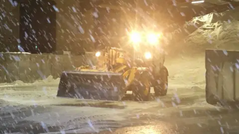 Bear NE Trunk Roads Snow falling at roads depot