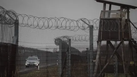 Getty Images Police patrol the Hungarian border fence with Serbia on 18 January, 2019