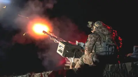 APRIL 16: Soldiers of the Armed Forces of Ukraine from the unit of the mobile air defense group shoot down enemy drones using the ZU-23-2 Soviet 23-mm twin anti-aircraft gun on April 16, 2024 in an undisclosed location in Ukraine. (Photo by Kostiantyn Liberov/Libkos/Getty Images)