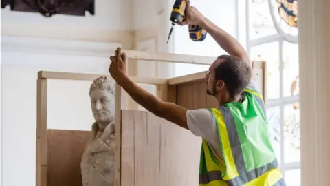 Getty Images Statue of enslaver and Waterloo war hero Sir Thomas Picton is boxed up in preparation for its removal in Cardiff City Hall on 24 July 2020