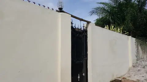 Ade Daramy The gate to a house in The Gambia