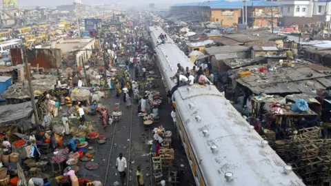 AFP Commuters sitting on top of a train in Lagos, Nigeria.