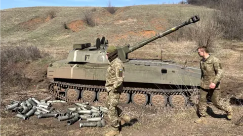 BBC Ukrainian forces alongside a tank