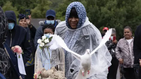 Alina Joseph releasing a dove