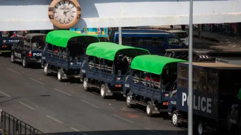 Getty Images View of police trucks parked aside the Streets in Yangon.