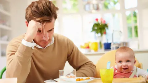Getty Images Man and baby
