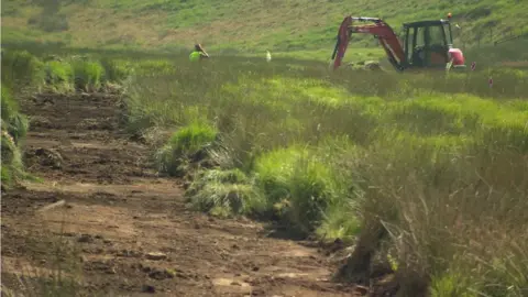 digger making a trench