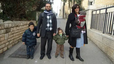 Getty Images Arieh, Jonathan and Gabriel Sandler (far L, L and C) who were murdered by Merah