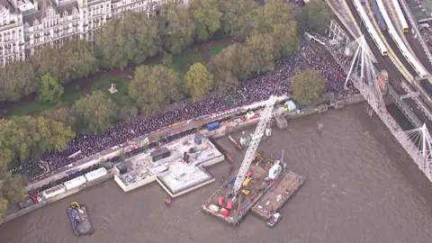 Thousands of pro-Palestinian protesters have gathered in central London with banners and posters