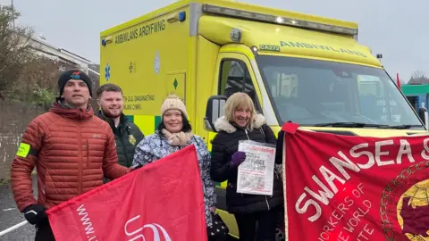 BBC Ambulance strikers and banners