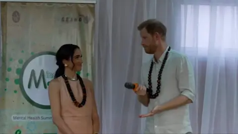 Duke and Duchess of Sussex speaking at event