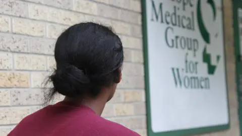 BBC Lucy (not her real name) outside the clinic