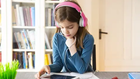 Getty Images A school pupil doing online learning