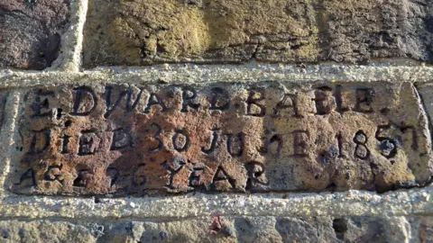 Historic England Etchings in wall