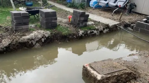 Rik and Jo Clews Moat outside Rik and Jo Clews house