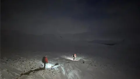 BRAEMAR MRT Two people were 'escorted' away from Glen Tilt after being caught in heavy snow.