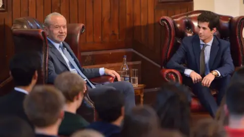 Getty Images Lord Sugar speaking at Cambridge Union