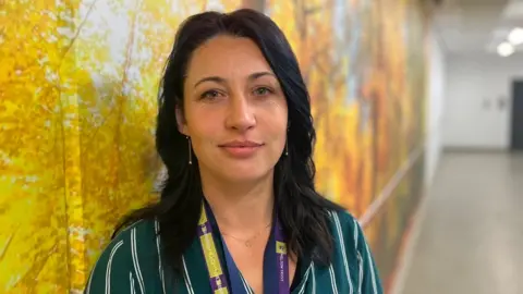 BBC A woman in a corridor