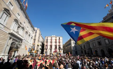 MARTA PEREZ/ EPA A Catalan pro-independence flag waves over hundreds of Catalan university and secondary students.