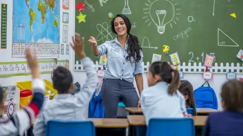 Getty Images A teacher in a school