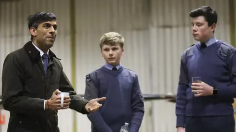 10 Downing Street Prime Minister Rishi Sunak speaks to RAF air cadets during a visit to RAF Valley on Anglesey