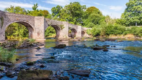 Getty Images The River Usk and Llangynidr Bridge in the Brecon Beacons National Park