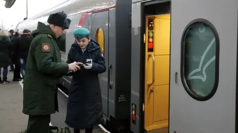 EPA Passengers board the Tavria train to Sevastopol from the Moscow railway station in St. Petersburg, Russia, 23 December 2019