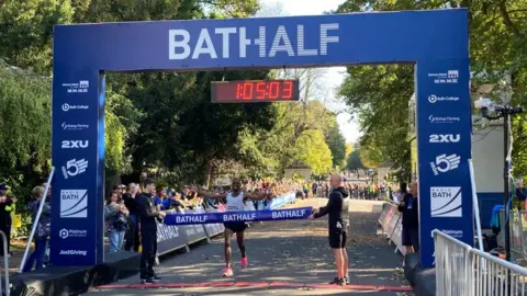 Kadar Omar coming over the finish line