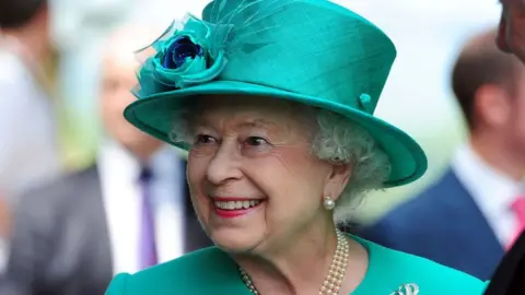 Queen Elizabeth II smiles during her trip to Bowness on Windermere, Cumbria on 17 July, 2013