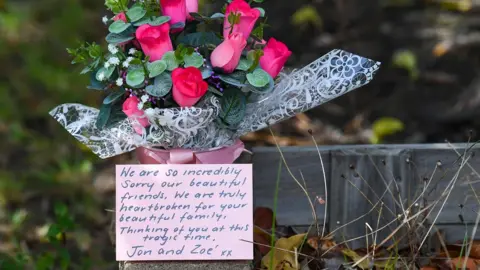 EPA Flowers with message left outside Lovell home