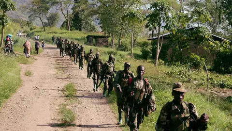 AFP Soldiers from the Uganda People Defense Forces (UPDF) patrol near the border with Congo after they engaged rebels from the Congolese Allied Democratic Force (ADF) in a fierce battle 28 March 2007 on the banks of Semuliki River