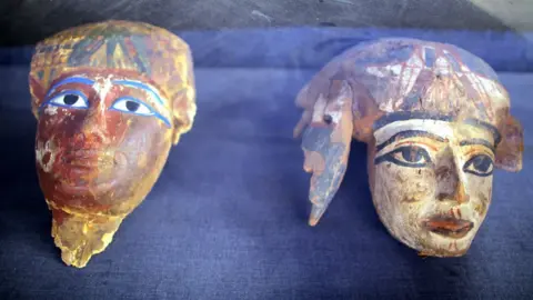 EPA Painted wooden masks on display at a tomb at Draa Abul Naga necropolis on Luxor, Egypt, 9 December 2017