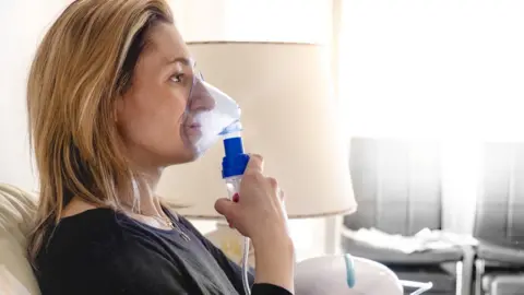 Getty Images woman using nebuliser