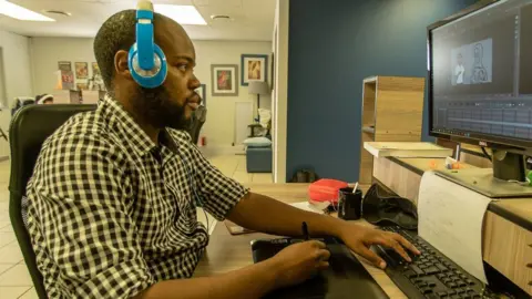 MY BETTER WORLD/CHRIS MORGAN One of the animators working on My Better World