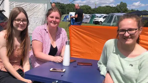 Jonathan Park/BBC Lauren, Abigail, and Darcy (left to right) at the Silverstone campsite