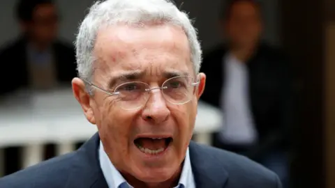 Reuters Colombia"s former president Alvaro Uribe Velez speaks to the news media after casting his vote