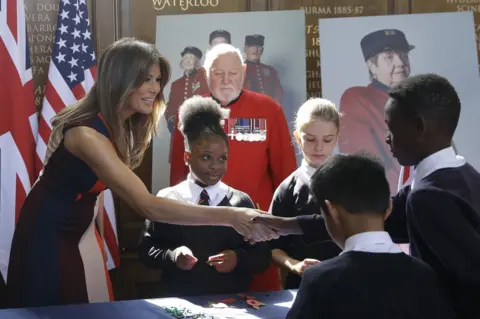 PA First Lady Melania Trump meets school children at the Royal Hospital in Chelsea, London