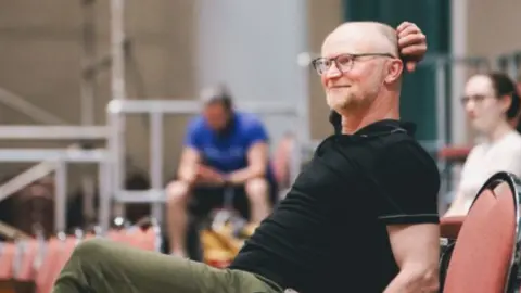 Andrew Billington Conrad Nelson watching rehearsals