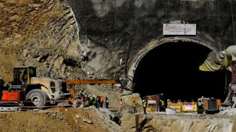 Reuters Machinery at the site where workers are trapped in a a tunnel in Uttarkashi, 18 November